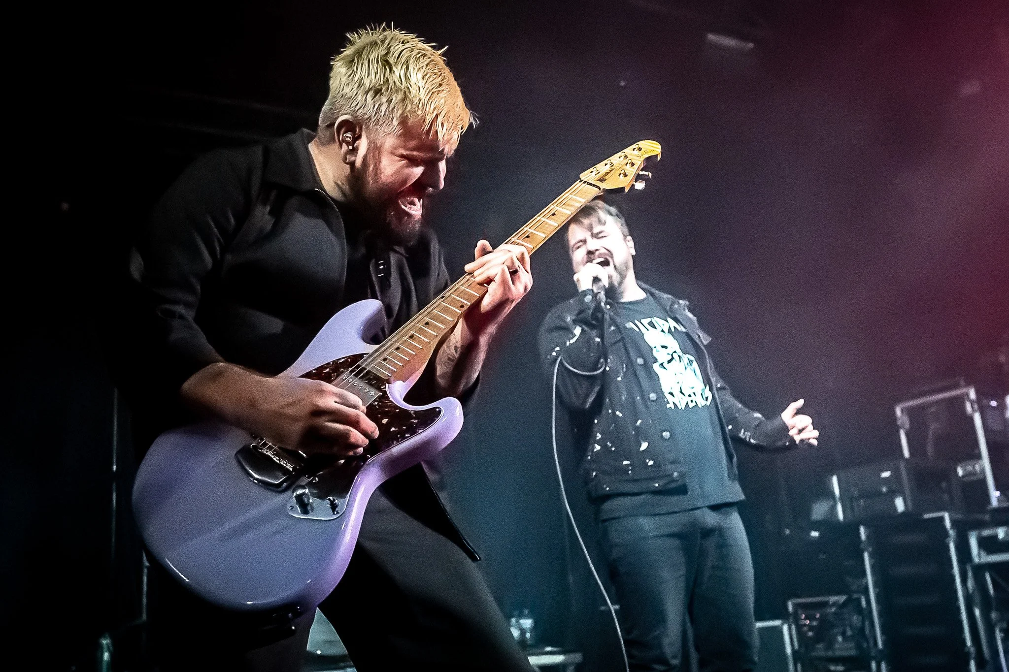 Silverstein guitarist and vocalist performing together on stage